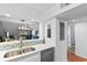 Galley kitchen featuring stone countertops, stainless steel appliances, and a modern backsplash at 180 Rothbury Circle # 305, Myrtle Beach, SC 29572