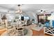 Open-concept living space features a dining area, comfortable seating, and sliding glass doors to the deck at 180 Rothbury Circle # 305, Myrtle Beach, SC 29572