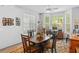 Cozy dining area featuring a wood table and a large window for natural lighting at 183 Glenwood Dr., Conway, SC 29526
