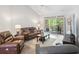 Bright living room with a vaulted ceiling and a leather sofa, creating a relaxing atmosphere at 183 Glenwood Dr., Conway, SC 29526