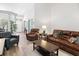 Well-lit living room featuring comfortable leather seating and an open entryway at 183 Glenwood Dr., Conway, SC 29526