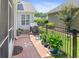 This patio features a grill, plants, a well manicured lawn, and an iron fence at 183 Glenwood Dr., Conway, SC 29526