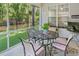 Screened patio featuring comfortable seating, an outdoor table, and views of the backyard at 183 Glenwood Dr., Conway, SC 29526