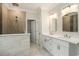 Modern bathroom with dual vanities, a walk-in shower featuring stylish tile work and fixtures at 1844 Wood Stork Dr., Conway, SC 29526