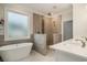 Luxurious bathroom featuring a soaking tub, walk-in shower, dual sinks, and contemporary finishes at 1844 Wood Stork Dr., Conway, SC 29526