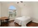 Bright bedroom with a large window, hardwood floors, and a simple design at 1844 Wood Stork Dr., Conway, SC 29526