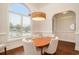 Inviting dining area with a wood table, stylish chairs, and large window with backyard views at 1844 Wood Stork Dr., Conway, SC 29526