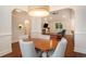 Open-concept dining area seamlessly connects to the living room with a cozy fireplace at 1844 Wood Stork Dr., Conway, SC 29526