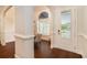Bright entryway showcasing hardwood floors and an arched doorway to a dining area at 1844 Wood Stork Dr., Conway, SC 29526
