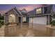 Beautiful blue home featuring a two-car garage, stone accents, and manicured landscaping at 1844 Wood Stork Dr., Conway, SC 29526