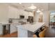 Modern kitchen featuring white cabinets, quartz countertops, pendant lighting and stainless appliances at 1844 Wood Stork Dr., Conway, SC 29526