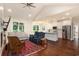 Open-concept living room showcasing seamless flow to the kitchen and a bright sunroom at 1844 Wood Stork Dr., Conway, SC 29526