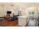 Open-concept kitchen and living room with fireplace and hardwood flooring at 1844 Wood Stork Dr., Conway, SC 29526