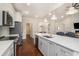 Open-concept kitchen and living room with fireplace and hardwood flooring at 1844 Wood Stork Dr., Conway, SC 29526