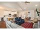 Open-concept living room view featuring a kitchen with white cabinets and an adjacent dining area at 1844 Wood Stork Dr., Conway, SC 29526