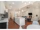 Open-concept kitchen and living room with fireplace and hardwood flooring at 1844 Wood Stork Dr., Conway, SC 29526