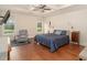 Spacious main bedroom with tray ceilings, a ceiling fan, and hardwood floors at 1844 Wood Stork Dr., Conway, SC 29526