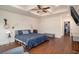 Spacious main bedroom with tray ceilings, a ceiling fan, and hardwood floors at 1844 Wood Stork Dr., Conway, SC 29526