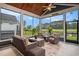 Relaxing screened porch with comfortable seating and views of the community golf course at 1844 Wood Stork Dr., Conway, SC 29526