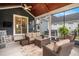 Inviting screened porch featuring comfortable outdoor seating and stylish decor with wood ceiling at 1844 Wood Stork Dr., Conway, SC 29526