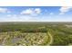 Aerial view of a lovely home in a well-maintained community near a pond at 195 Black Pepper Loop, Little River, SC 29566