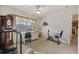 Functional spare bedroom featuring a desk, exercise bike, and serene natural light at 195 Black Pepper Loop, Little River, SC 29566