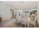 Bright dining room featuring a white dining set and view into other rooms at 195 Black Pepper Loop, Little River, SC 29566