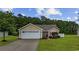 Charming single-story home with a two-car garage, well-kept lawn, and inviting curb appeal at 195 Black Pepper Loop, Little River, SC 29566