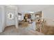 Open kitchen and dining area with light-colored cabinets, breakfast bar, and a sunny ambiance at 195 Black Pepper Loop, Little River, SC 29566