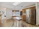 Eat-in kitchen area with stainless steel appliances, bright lighting, and a cozy dining nook at 195 Black Pepper Loop, Little River, SC 29566