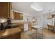 Spacious kitchen layout featuring wood cabinetry, modern appliances, and convenient access to other living spaces at 195 Black Pepper Loop, Little River, SC 29566