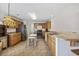 Functional kitchen showcasing stainless steel refrigerator, oak cabinets, and a view of the breakfast bar at 195 Black Pepper Loop, Little River, SC 29566