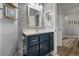 Stylish bathroom featuring a modern vanity with blue cabinetry and tiled floors at 1984 Green Fern Ln. # 1984, Myrtle Beach, SC 29579