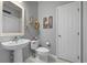 Cozy bathroom featuring pedestal sink, toilet and door for added convenience at 1984 Green Fern Ln. # 1984, Myrtle Beach, SC 29579