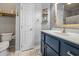 Stylish bathroom featuring a modern vanity with blue cabinetry and tiled floors at 1984 Green Fern Ln. # 1984, Myrtle Beach, SC 29579