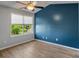 Bedroom featuring wood-look floors, large window, ceiling fan and bright paint at 1984 Green Fern Ln. # 1984, Myrtle Beach, SC 29579