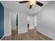 Bedroom with open closet, neutral walls and wood-look flooring, offering versatility at 1984 Green Fern Ln. # 1984, Myrtle Beach, SC 29579