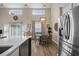 Spacious dining area with views of the kitchen, lots of natural light, and wood-look flooring at 1984 Green Fern Ln. # 1984, Myrtle Beach, SC 29579