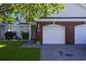 Charming home exterior featuring a brick facade garage and well-maintained lawn and mature landscaping at 1984 Green Fern Ln. # 1984, Myrtle Beach, SC 29579