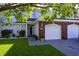 Inviting two-story home featuring a well-kept lawn, brick accents, and a convenient two-car garage at 1984 Green Fern Ln. # 1984, Myrtle Beach, SC 29579