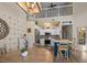 Kitchen with stainless steel appliances, white cabinets, and kitchen island with seating, under a vaulted ceiling at 1984 Green Fern Ln. # 1984, Myrtle Beach, SC 29579