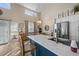 Bright eat-in kitchen features an island with quartz countertops, stainless steel appliances, and ample natural light at 1984 Green Fern Ln. # 1984, Myrtle Beach, SC 29579