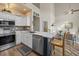 Modern kitchen featuring stainless steel appliances, a stylish backsplash, and island with breakfast bar seating at 1984 Green Fern Ln. # 1984, Myrtle Beach, SC 29579