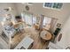 Bright open floor plan showcasing the living room and dining area with hardwood floors and lots of natural light at 1984 Green Fern Ln. # 1984, Myrtle Beach, SC 29579