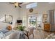 Bright and open living room with hardwood floors, a ceiling fan and lots of natural light at 1984 Green Fern Ln. # 1984, Myrtle Beach, SC 29579