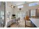Sun-filled living room with soaring ceilings, modern decor, and sliding glass doors at 1984 Green Fern Ln. # 1984, Myrtle Beach, SC 29579
