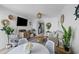 Open living room with view of kitchen, featuring modern furnishings and natural light at 2001 S Ocean Blvd. # 1405, Myrtle Beach, SC 29577
