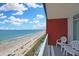 Breathtaking oceanfront view from the balcony, furnished with chairs to enjoy the beach and pool views at 2007 S Ocean Blvd. # 1403, Myrtle Beach, SC 29577