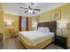 Comfortable bedroom featuring a king-sized bed and a ceiling fan at 2007 S Ocean Blvd. # 1403, Myrtle Beach, SC 29577