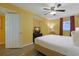 Bedroom showcasing a window with curtains and a TV on a black dresser at 2007 S Ocean Blvd. # 1403, Myrtle Beach, SC 29577